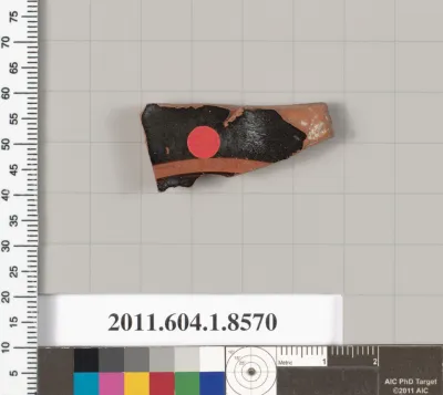 Terracotta fragment of a stemless kylix (drinking cup)