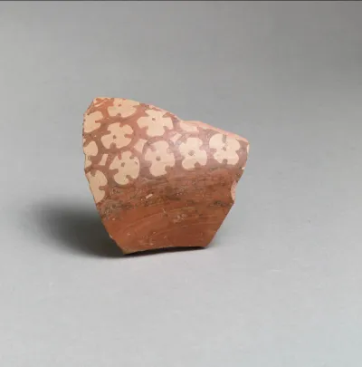 Terracotta vessel fragment with rosettes