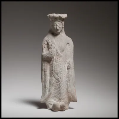 Terracotta statuette of a standing woman