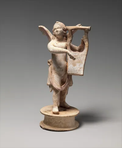 Terracotta statuette of Eros playing a lyre