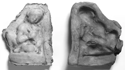 Mold of a Crouching Male Child Holding a Puppy