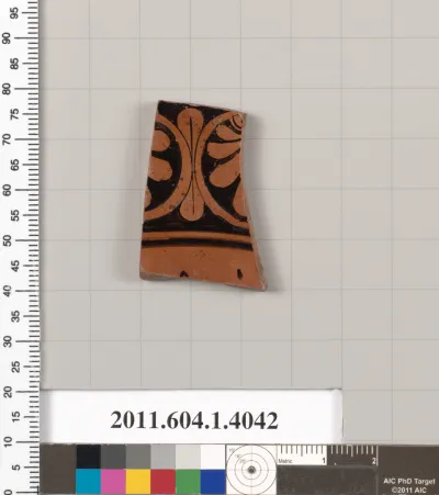 Terracotta fragment of a bilingual? kylix (drinking cup)