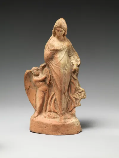 Terracotta statuette of dancing Aphrodite with Eros