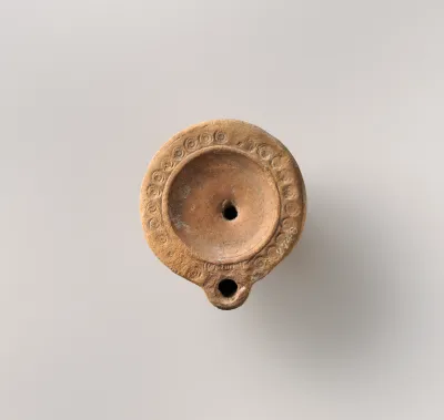 Terracotta oil lamp