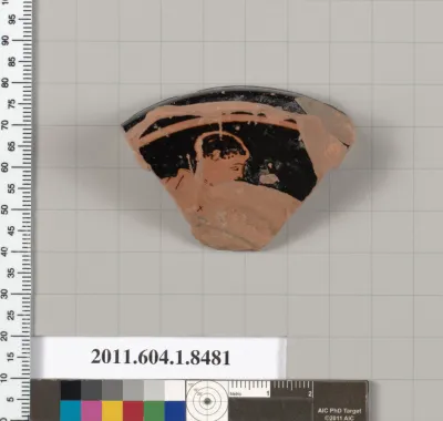 Terracotta fragment of a stemless kylix (drinking cup)