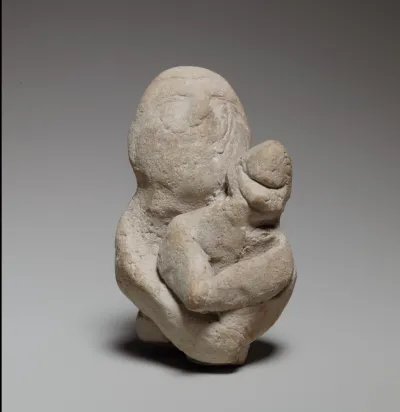 Two figures in a scene of childbirth