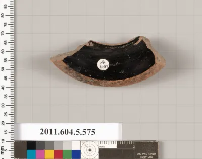Terracotta fragment of a stemless kylix (drinking cup)