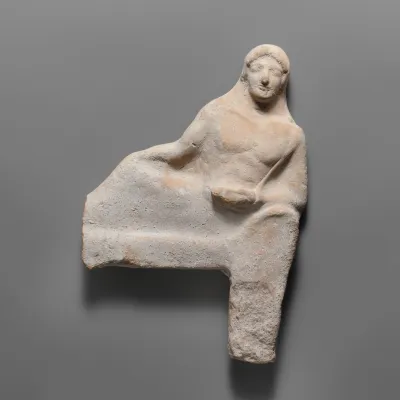 Fragmentary terracotta relief of a reclining figure