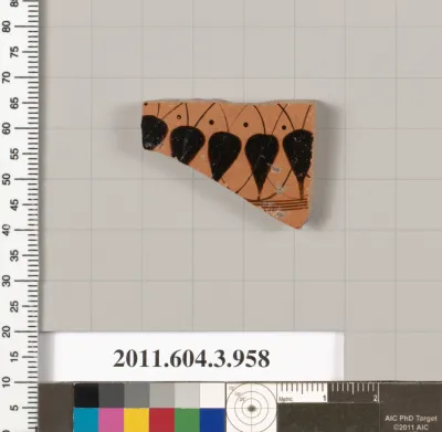 Terracotta fragment of a lekanis lid (covered dish)