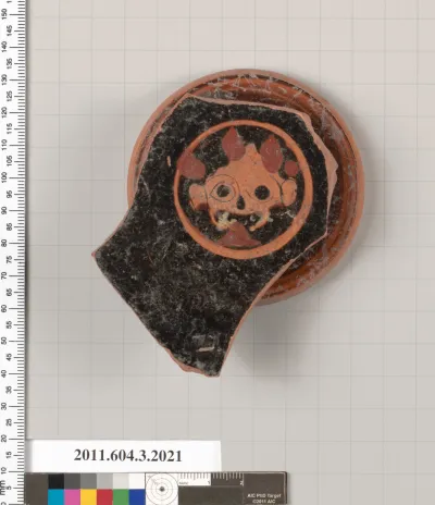 Terracotta fragment of a kylix (drinking cup)