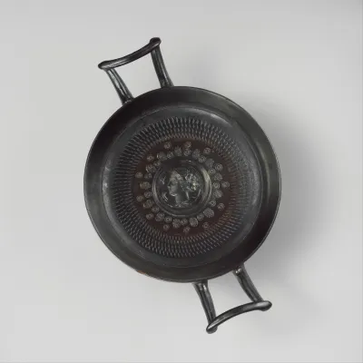 Terracotta stemless kylix (drinking cup)