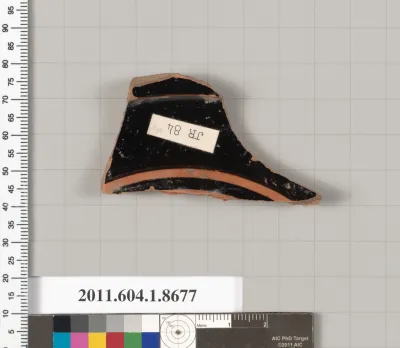 Terracotta fragment of a stemless kylix (drinking cup)