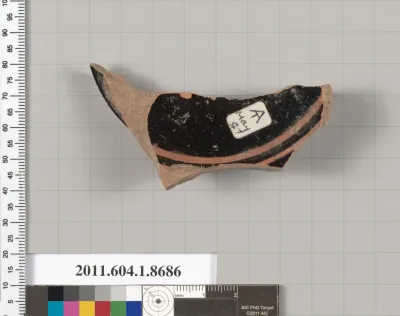 Terracotta fragment of a stemless kylix (drinking cup)