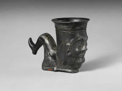 Terracotta vessel in the shape of a bent leg