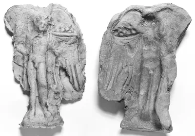 Mold of the Front of a Winged Daimon Holding a Liknon (winnowing basket)
