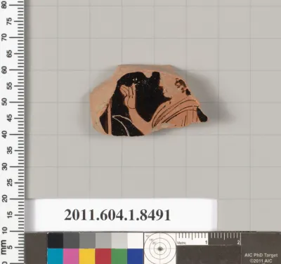 Terracotta fragment of a stemless kylix (drinking cup)