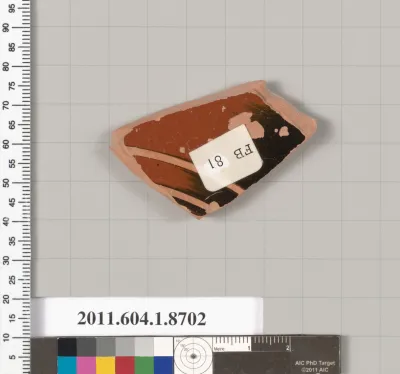 Terracotta fragment of a stemless kylix (drinking cup)