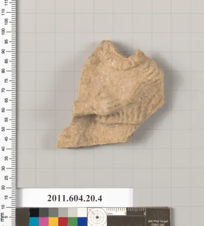 Fragment of a statuette of a woman