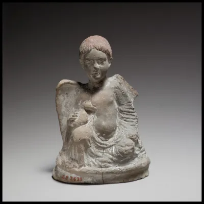 Terracotta statuette of Eros seated and holding a duck