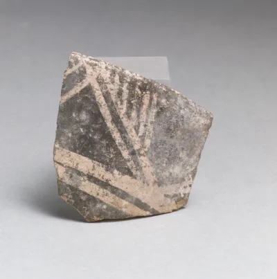 Terracotta rim from a cup with triangles and parallel vertical lines