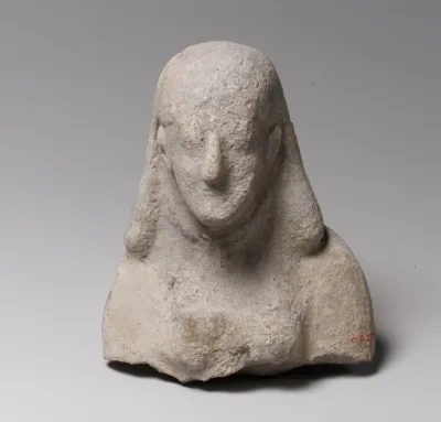 Head and upper body of a female figurine