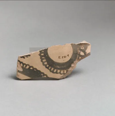 Terracotta vessel fragment with curvilinear decoration