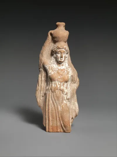 Terracotta statuette of a female votary carrying a hydria