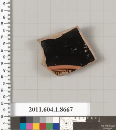 Terracotta fragment of a stemless kylix (drinking cup)
