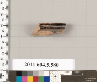 Terracotta fragment of a stemless kylix (drinking cup)