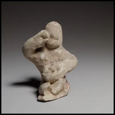 Seated male figurine