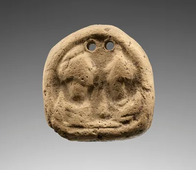 Loom weight with Two Confronting Heads