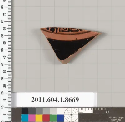 Terracotta fragment of a stemless kylix (drinking cup)