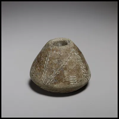 Terracotta truncated-biconical spindle-whorl with angular base