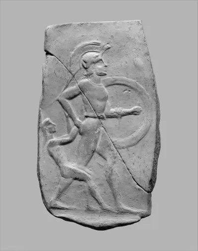 Terracotta relief of a warrior dragging a captive