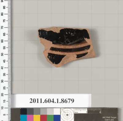 Terracotta fragment of a stemless kylix (drinking cup)