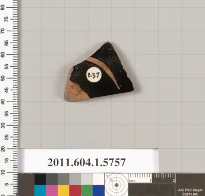 Terracotta fragment of a kylix: eye-cup  (drinking cup)