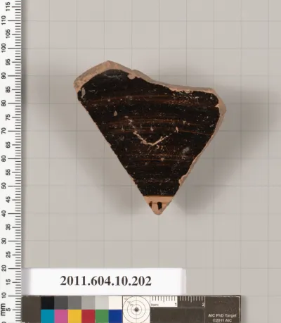 Terracotta fragment from a kylix (drinking cup)