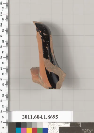 Terracotta fragment of a stemless kylix (drinking cup)