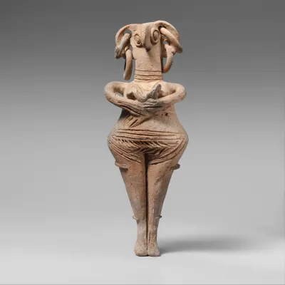Terracotta statuette of woman with bird face