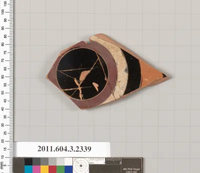 Terracotta fragment of a kylix: eye-cup (drinking cup)