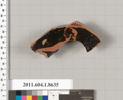 Terracotta fragment of a stemless kylix (drinking cup)