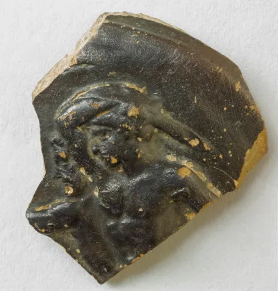 Fragment of a terracotta guttus (oil flask)