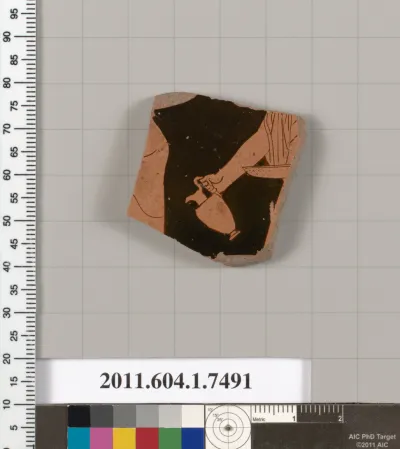 Terracotta fragment of a kylix (drinking cup)