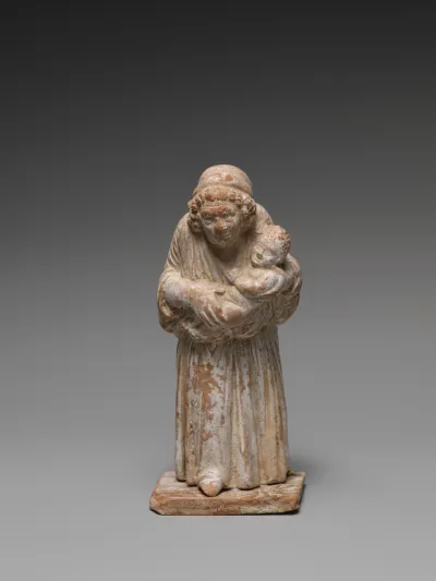 Terracotta statuette of an old nurse holding a child