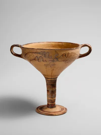 Terracotta stemmed cup with murex decoration