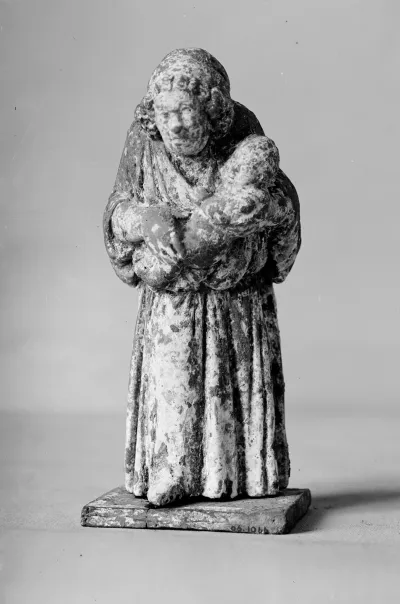 Terracotta statuette of a nurse carrying a child