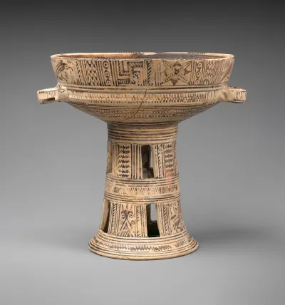 Terracotta bowl on a high stand