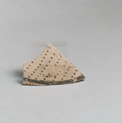 Terracotta vessel fragment with rows of dots and band