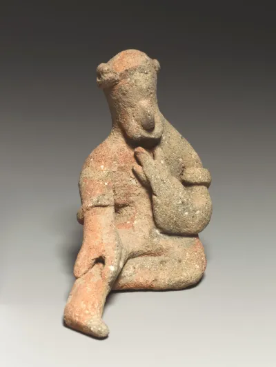 Seated male figurine