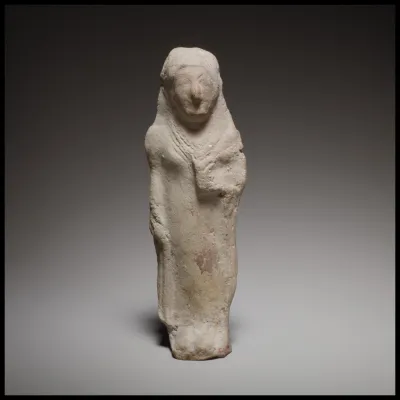 Standing female figurine holding a flower